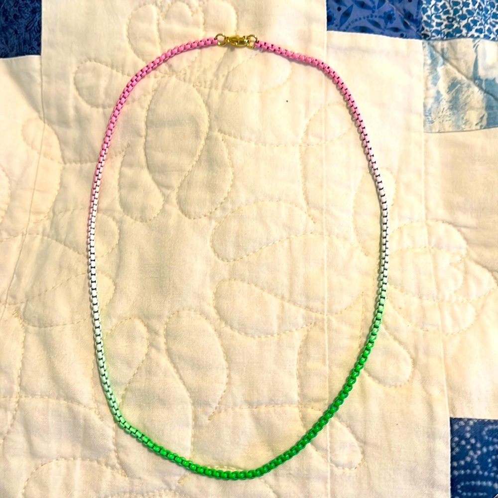 Green, pink and white chain necklace.